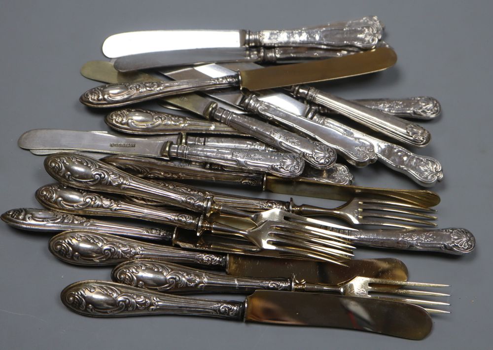 Five pairs of Persian white metal handles fruit knives & forks and twelve silver handled cake knives.